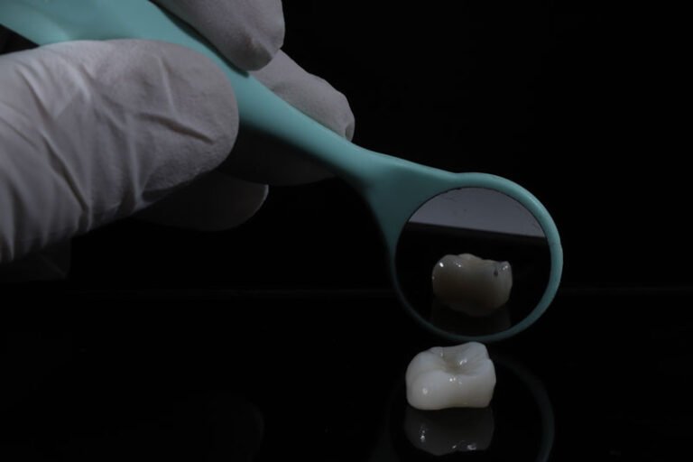 a dental crown being show with a mirror behind it